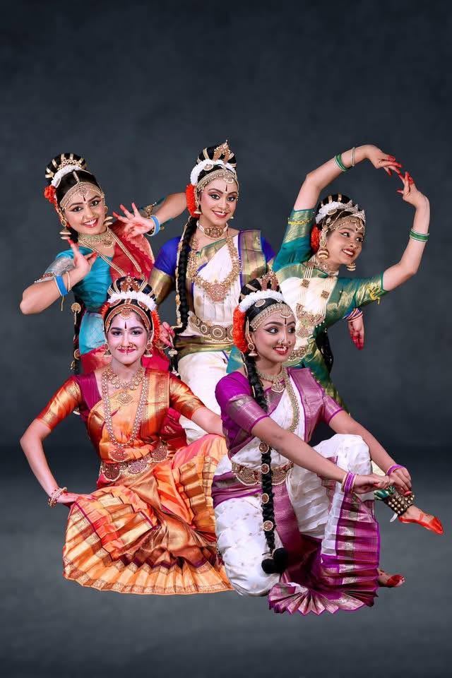 Five Madhuri Kishore School of Kuchipudi dancers in expressive coordinated poses